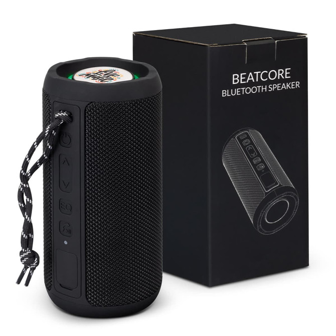 A black Bluetooth speaker with a textured surface, accompanied by a branded box featuring various buttons and a carrying strap.