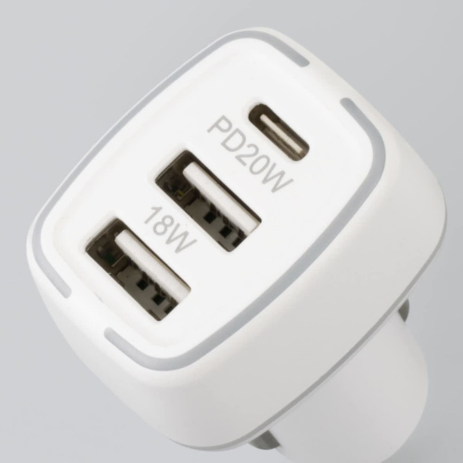 A white USB car charger featuring three ports, including one USB-C and two USB-A, with a compact design.