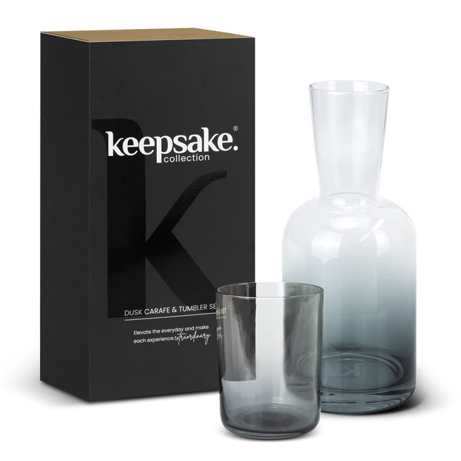 A glass carafe and tumbler set in grey, packaged in a black box with a logo.
