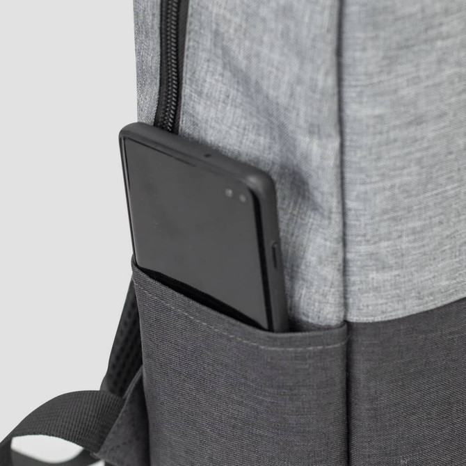 A grey backpack with a black section and a phone stored in a side pocket. It features a logo.