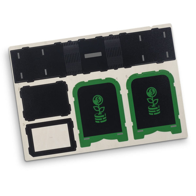 A wooden money box model with green and black components, featuring cut-out designs and a logo.