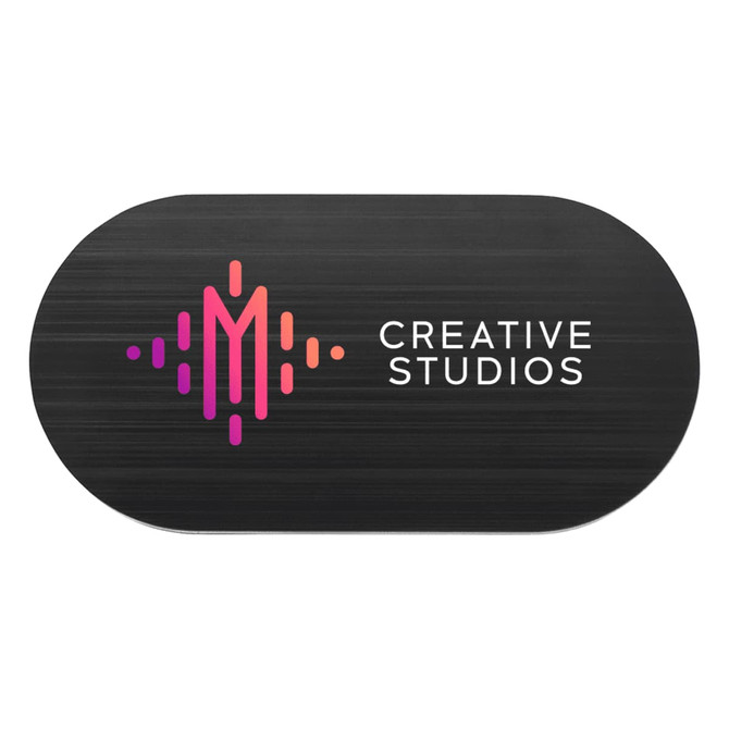 A black oval-shaped promotional item featuring a logo with pink and purple elements and the text "Creative Studios."