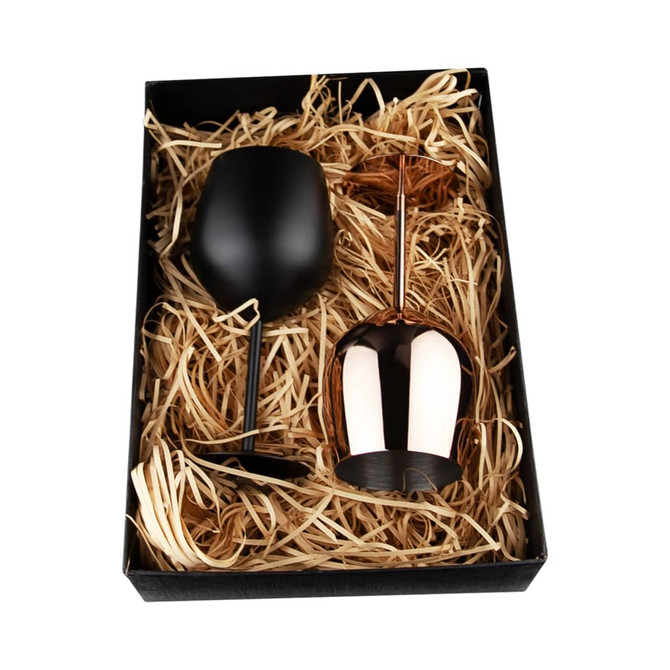 A black stainless steel wine glass and a copper stainless steel wine glass in a gift box with straw filling.
