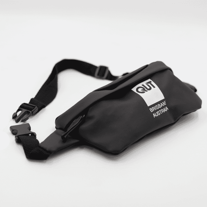 A black Boston Bag with an adjustable strap and a logo, featuring a sleek, minimalist design.