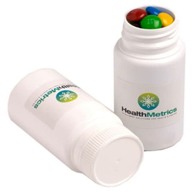 A pill jar containing colourful M&Ms, featuring a white container with a logo.