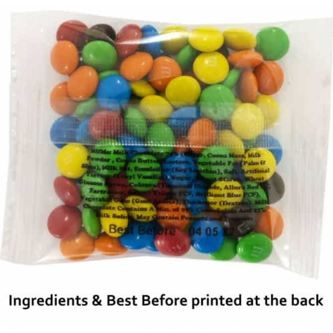 A bag of Mini M&Ms featuring assorted colours including red, blue, green, yellow, brown, and orange. Includes branding.