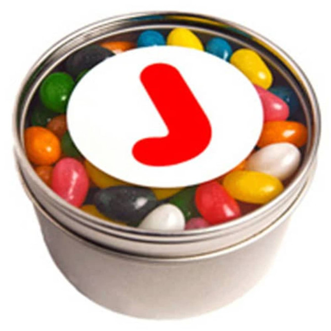 A small round tin with a silver finish, filled with colourful jelly beans and featuring a logo on the lid.