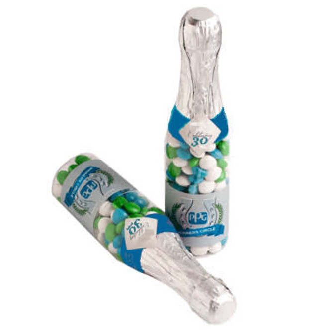 A drink bottle designed like a champagne bottle, filled with chewy fruit sweets in green and white.
