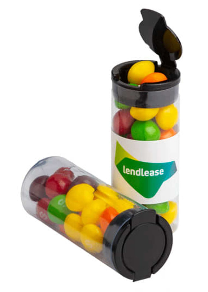 A Flip Lid Tube filled with colourful Skittles in various shades of red, yellow, green, and purple, featuring a logo.
