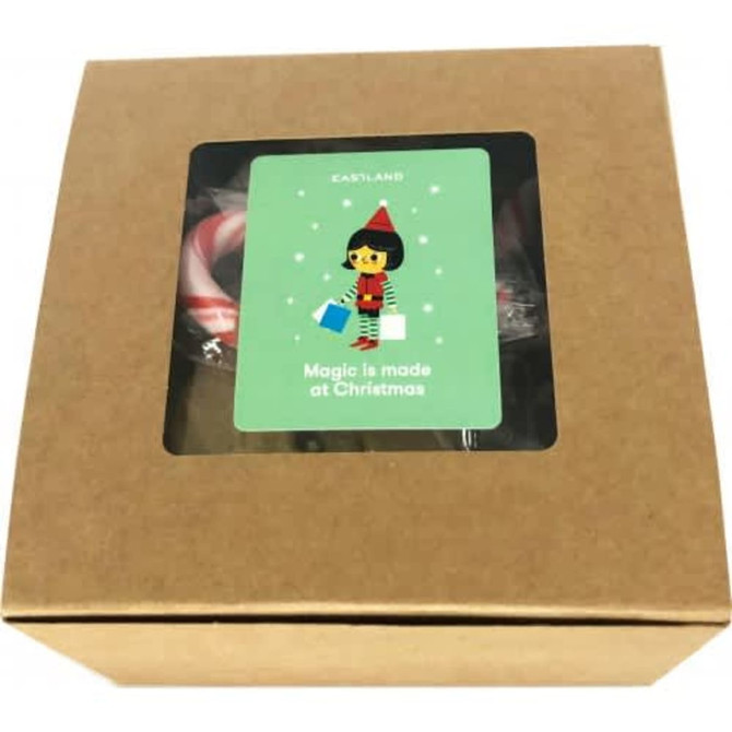 A small kraft gift box, featuring a festive design and containing holiday treats. The box is brown with a colourful label.