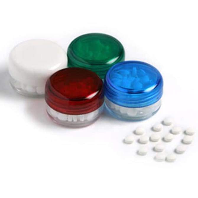 Small screw cap jars in red, green, blue, and white, containing small white tablets beside them. Jars feature logos.