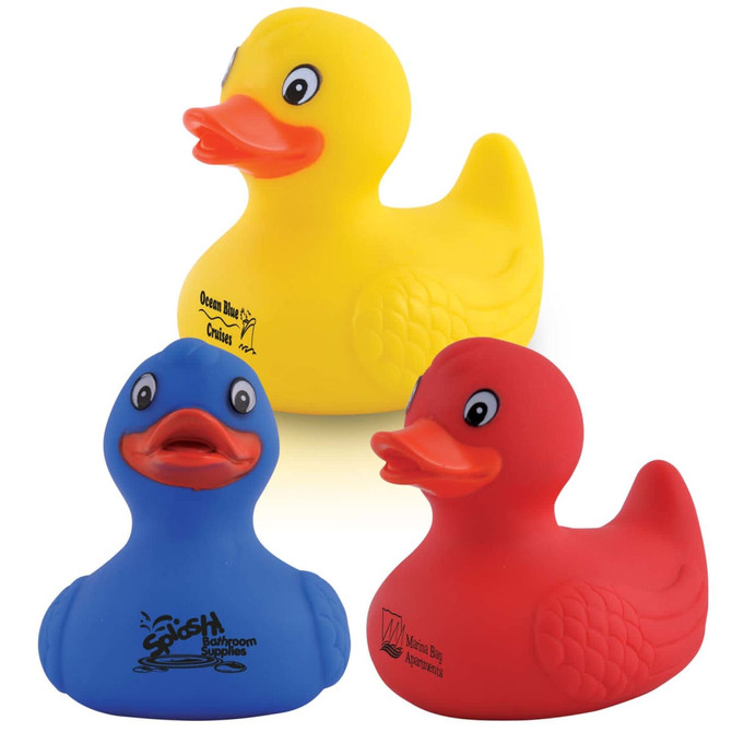 Three rubber bath ducks in yellow, blue, and red colors, featuring promotional logos on the blue and red ducks.