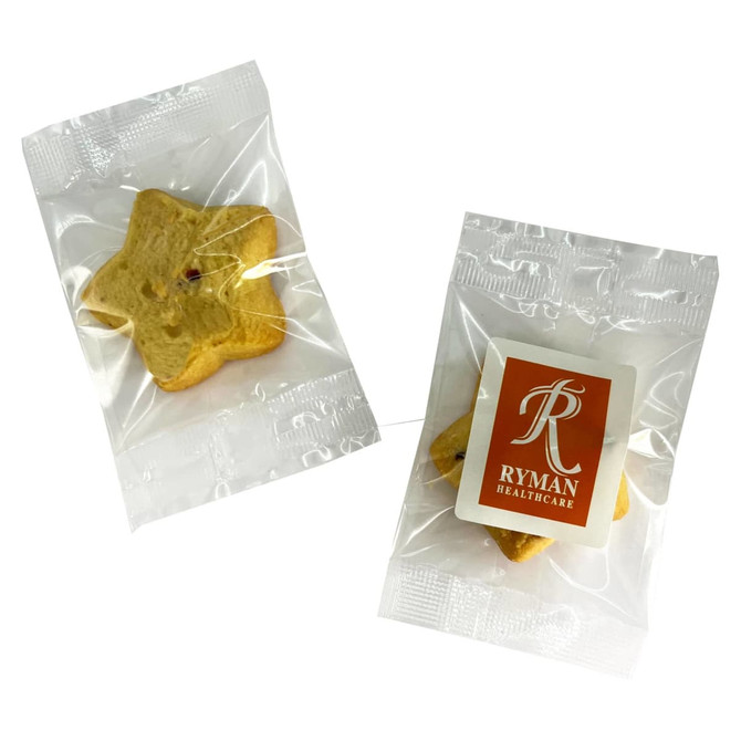 Two individually wrapped shortbread star biscuits in light yellow, featuring a logo on one package.