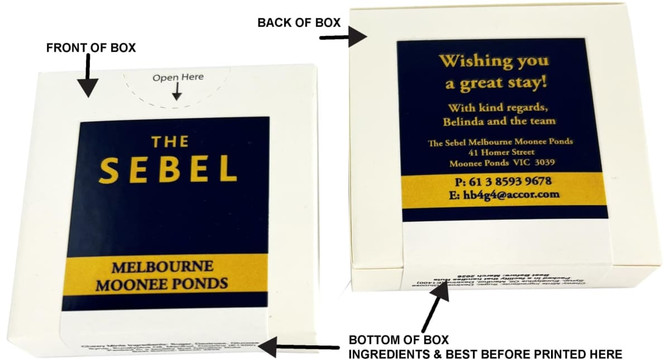 A cardboard box with a flip lid, featuring mints. The box is predominantly white with blue and yellow accents.