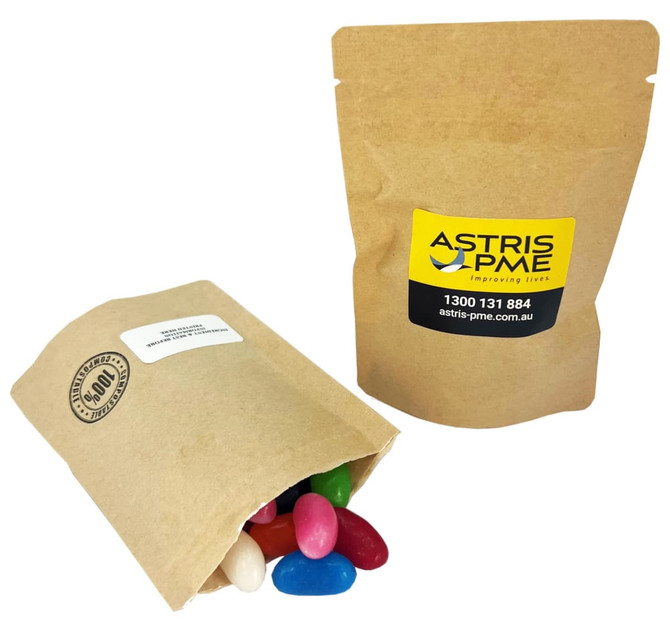 A kraft paper bag containing colourful jelly beans, with another closed bag beside it, featuring a logo.
