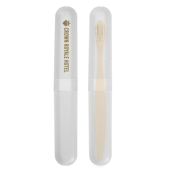 A toothbrush case featuring a transparent exterior and a bamboo toothbrush inside, labeled with "Crown Royale Hotel."