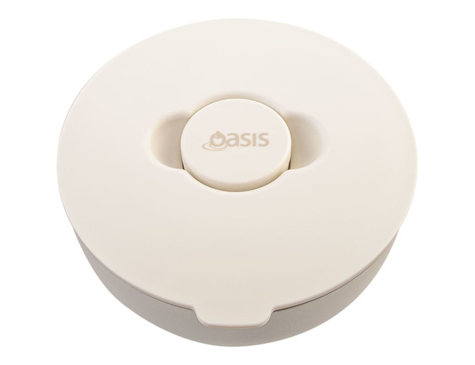 A lunch bowl with a rounded design, featuring a light beige colour and a central button. It has a logo on the top.