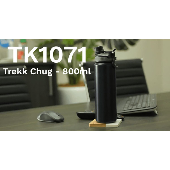 A drink bottle in black, featuring a logo, placed on a wooden coaster with a mouse and keyboard in the background.