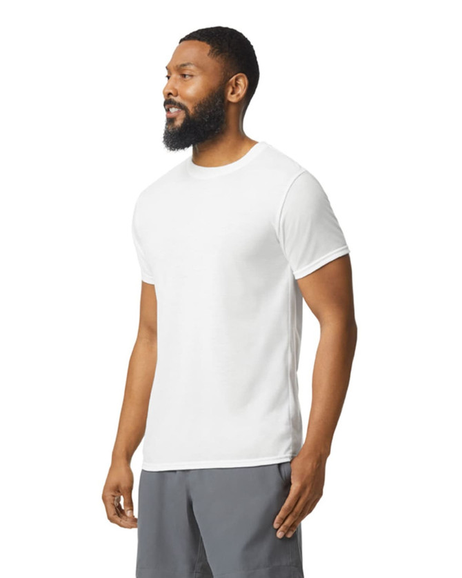 A white Gildan Performance adult T-shirt displayed on a male model, featuring short sleeves and a round neckline.