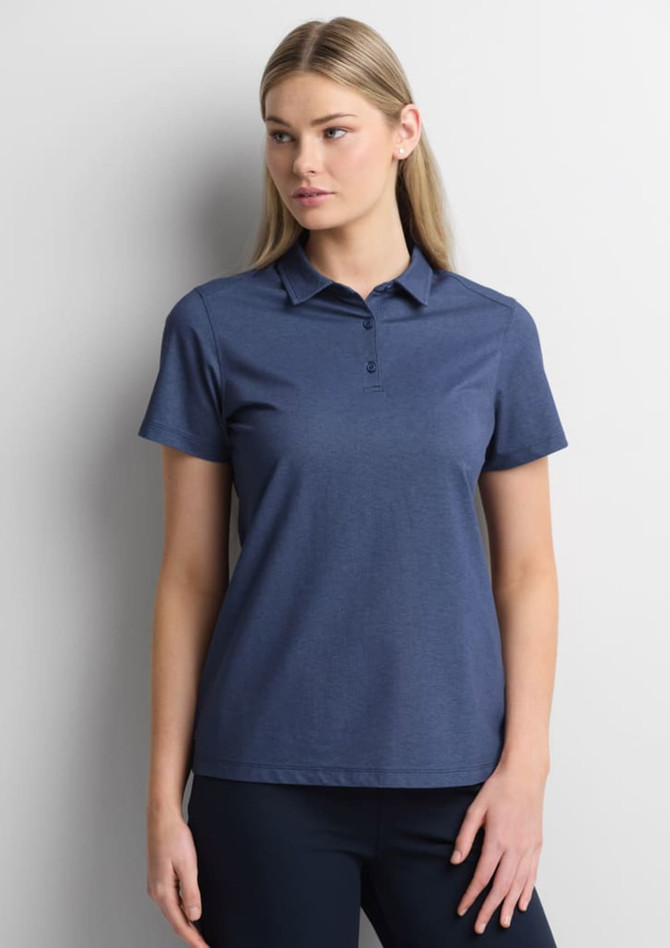 A women's short sleeve polo in navy, featuring a collar and a logo. The model is posing against a neutral background.