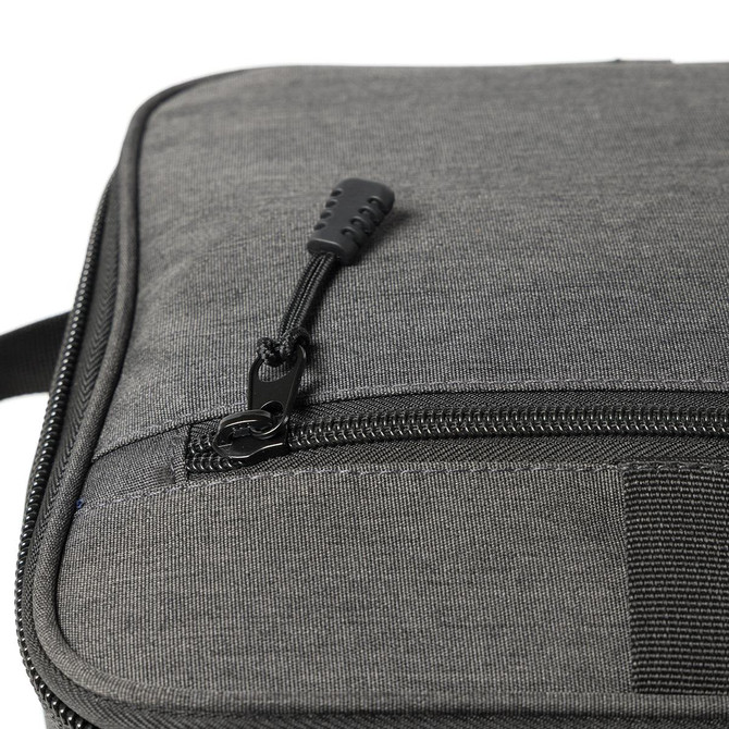 A grey cooler bag featuring a zippered closure and textured fabric. It includes a logo.