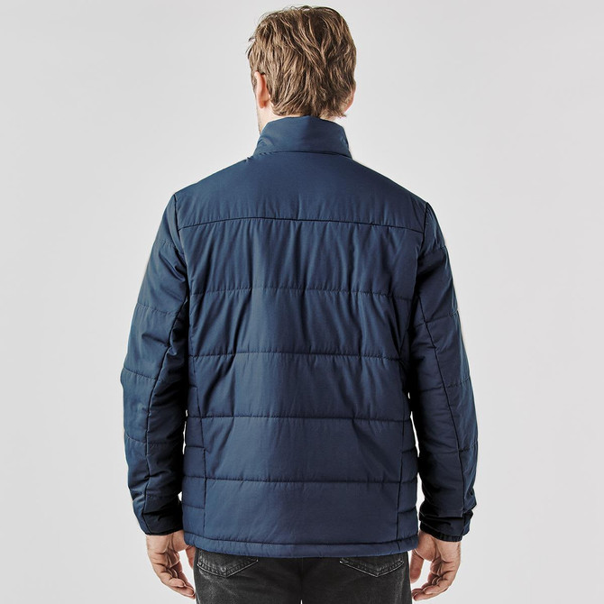 A thermal puffer jacket in navy, featuring a quilted design and a high collar. It has a logo on the exterior.