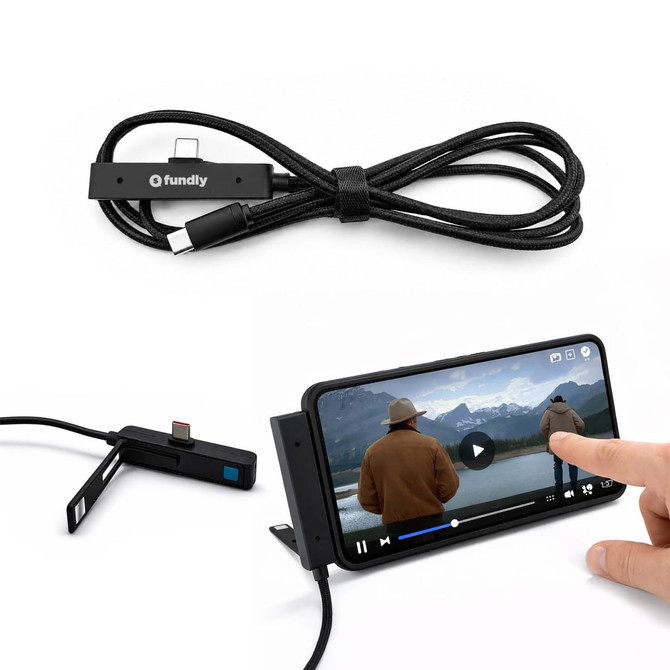 A charging cable in black with a logo, displayed alongside a phone on a stand playing a video.