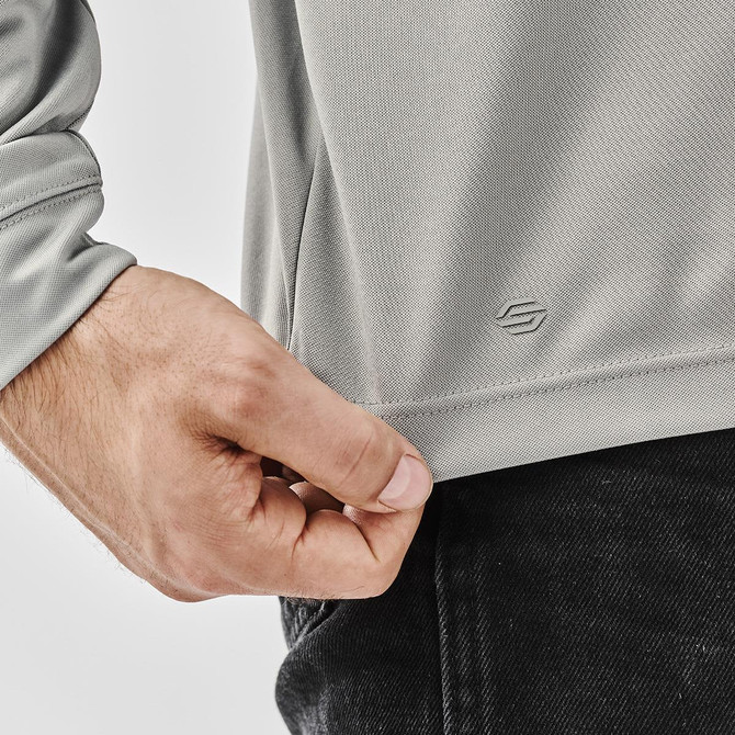 A grey 1/4 zip pullover with a fitted design and a logo at the hem. Suitable for casual wear.