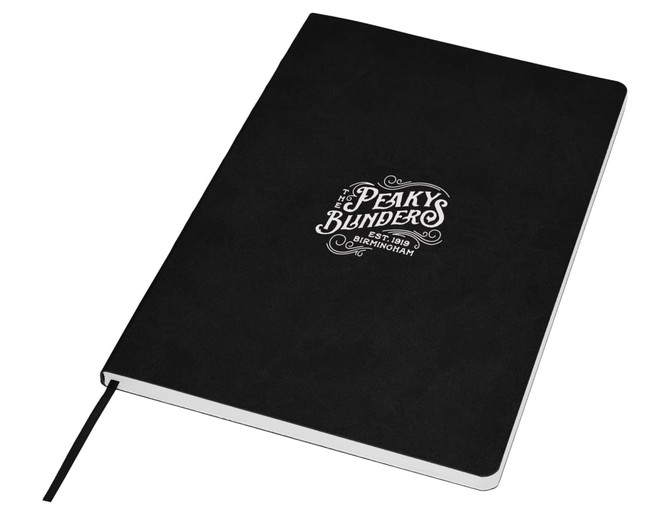 A black A5 notebook with a logo on the cover and a ribbon bookmark. It features a textured finish.