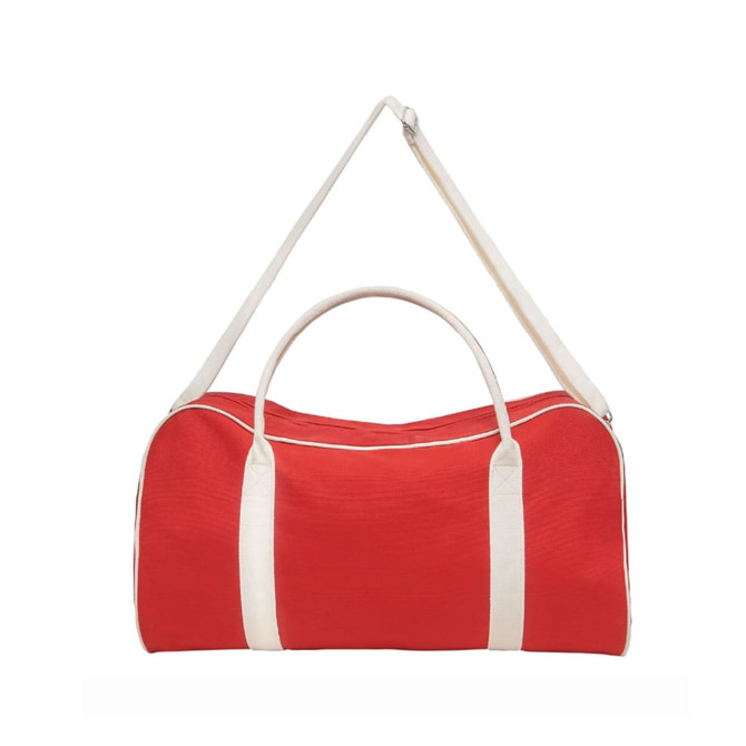 A red duffle bag with a white handle and shoulder strap, featuring branding.