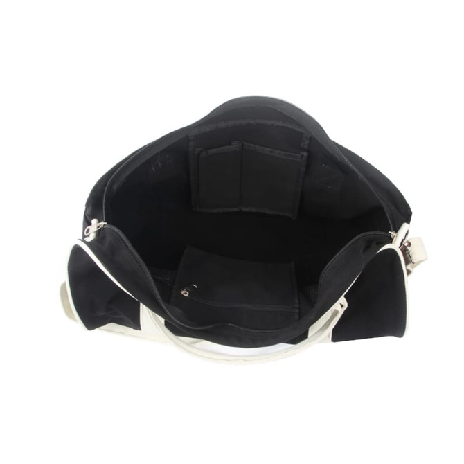 An open black and white duffle bag showcasing multiple interior pockets and compartments.