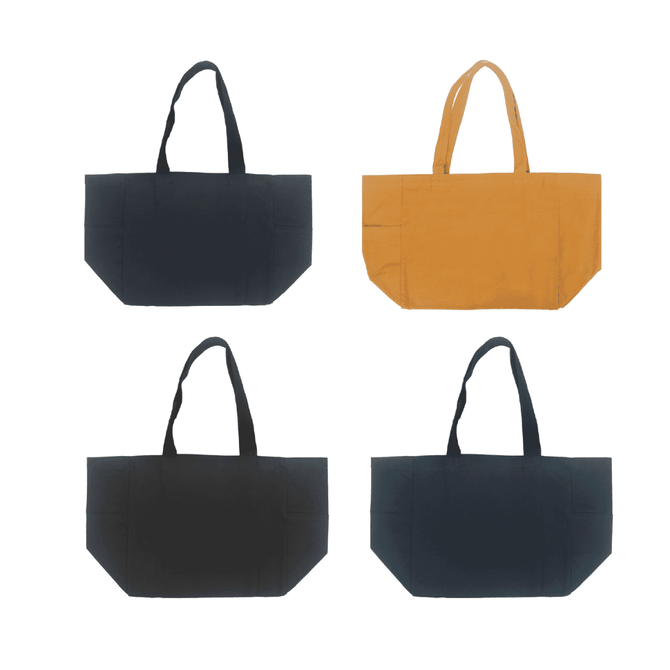 A canvas tote bag collection featuring black, navy, and mustard colours, with two bags in each colour. Each bag has handles and a logo.