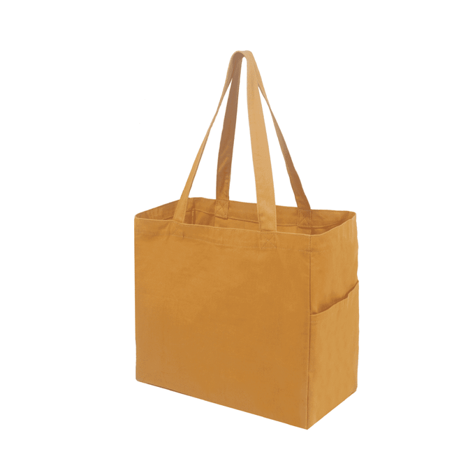 A mustard-coloured canvas tote bag with two long handles and a side pocket, featuring a logo.