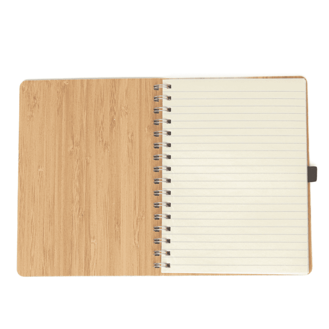 A bamboo notebook featuring a spiral binding and lined pages, showcasing a natural wood finish.