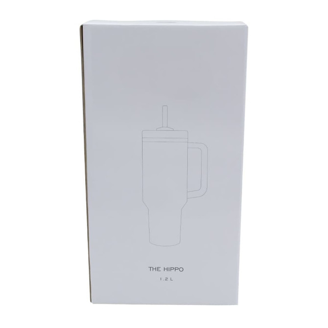 A drink bottle in a white box, featuring a minimalistic design and a handle. It has a logo on the packaging.