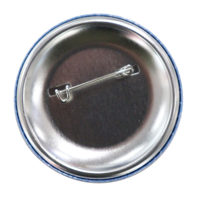 A 44mm button badge with a shiny silver backing and a pin attachment, featuring a blue rim.
