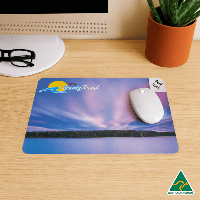 A mouse mat featuring a scenic design in purple and blue, with a peel-back feature and a logo.