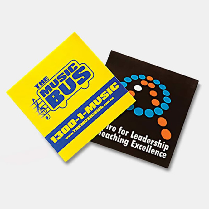 Two vinyl stickers in bright yellow and black, featuring distinctive logos and designs. Each sticker measures 75 x 75mm.