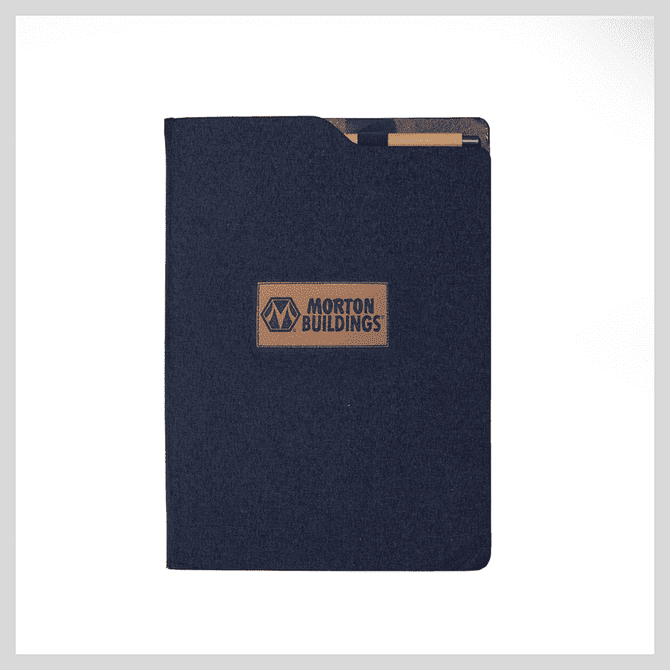 A navy notebook with a textured cover and a brand logo in the centre. Features an exterior pocket.