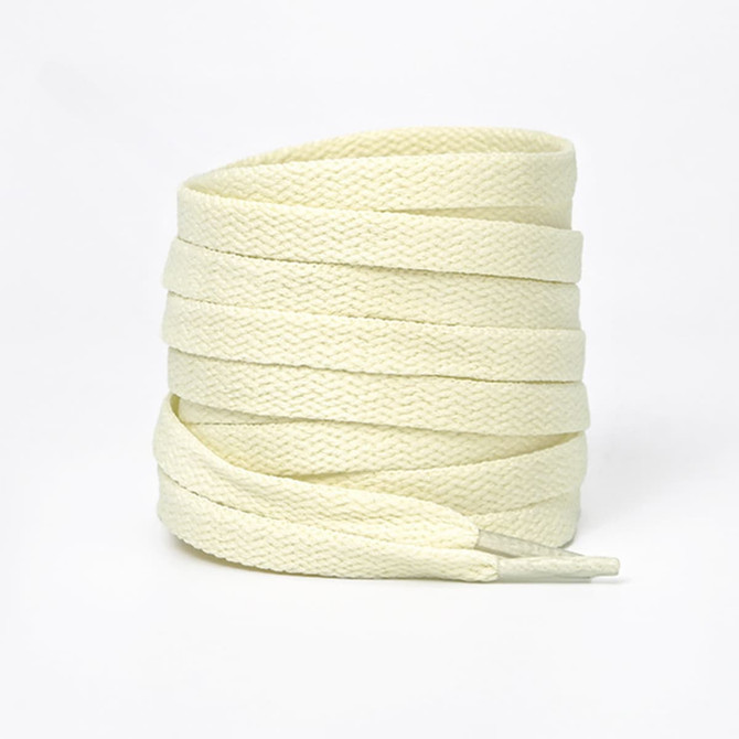 A bundle of cream-coloured shoe laces, neatly coiled and featuring pointed tips. Includes a logo on the packaging.