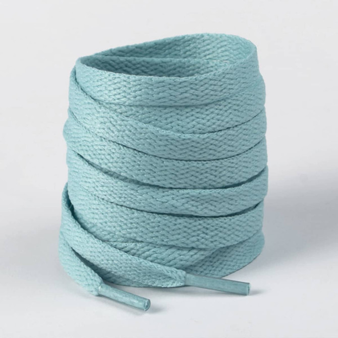 A roll of light blue shoe laces, neatly coiled with tapered ends, featuring a textured finish.