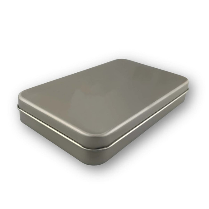 A grey metal box with a hinged lid, designed to hold a set of brushes.