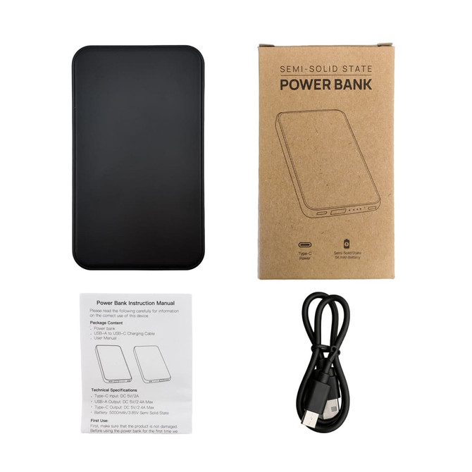 A black power bank with a sleek design, accompanied by a user manual and a USB charging cable.