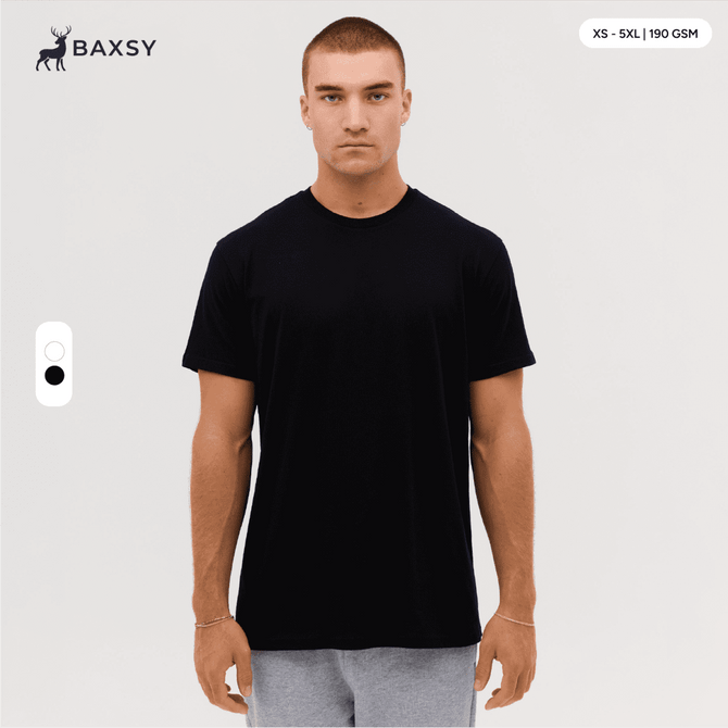 A black t-shirt is displayed on a model, featuring a round neck and short sleeves, with a logo visible.