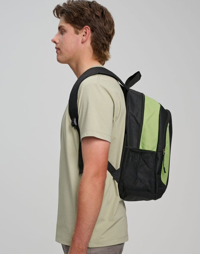 A black and green backpack worn on one shoulder by a person wearing a light-coloured t-shirt. It has a logo.