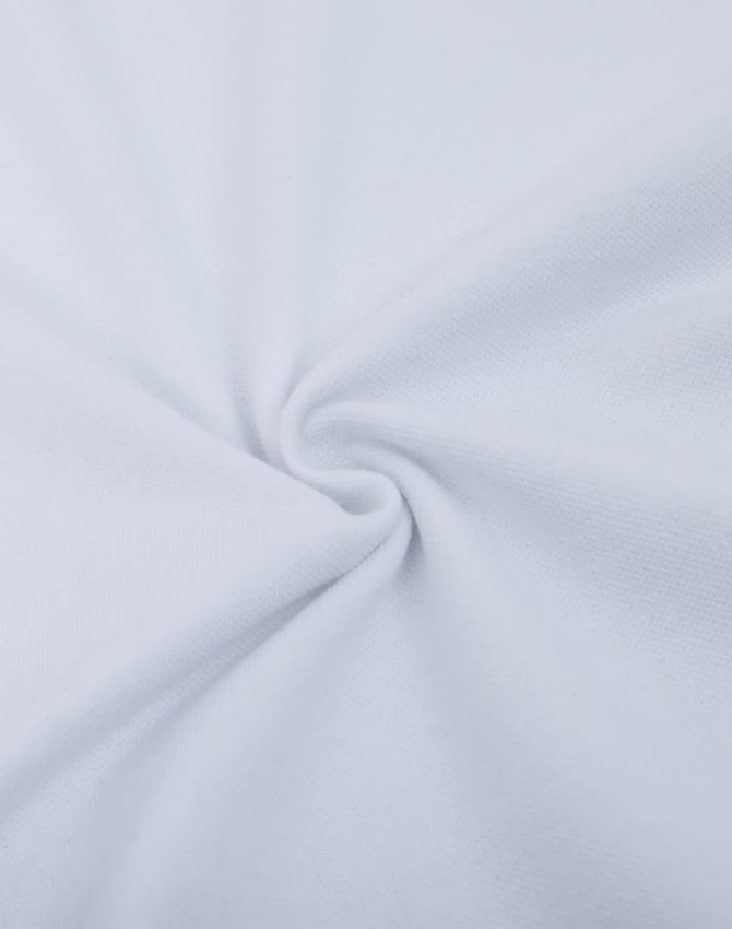 A close-up of white cotton/poly pique fabric, featuring a smooth, textured surface with a spiral twist.