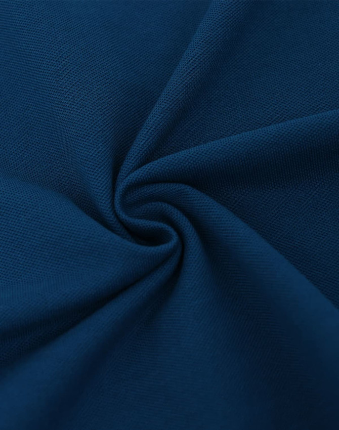 A close-up view of navy ultrafine cotton pique fabric, showcasing its smooth texture and soft weave.