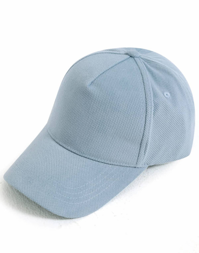 A light blue jacquard texture five-panel cap with a curved brim and a branding logo.