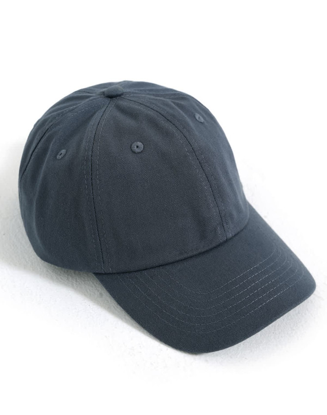 A dark navy cotton twill unstructured cap with a curved brim and six ventilation eyelets. It features a logo.