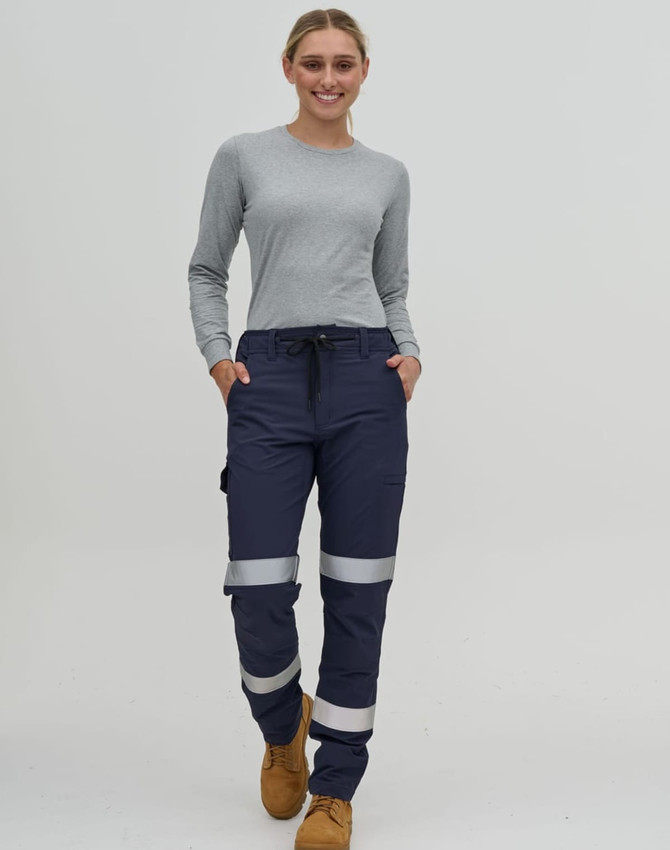 Navy water-repellent flexi work pants with reflective tape, worn by a person in a grey long-sleeve top.